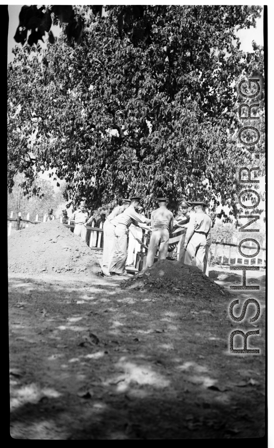 Solemn burial ceremony for American GIS who had died at a temporary war-time graveyard. In the CBI, during WWII.