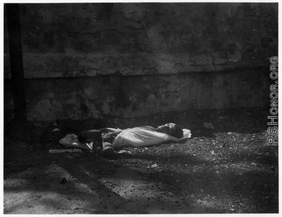 Unfortunate soul who died from famine, disease, or other cause.  Scenes in India witnessed by American GIs during WWII. For many Americans of that era, with their limited experience traveling, the everyday sights and sounds overseas were new, intriguing, and photo worthy.