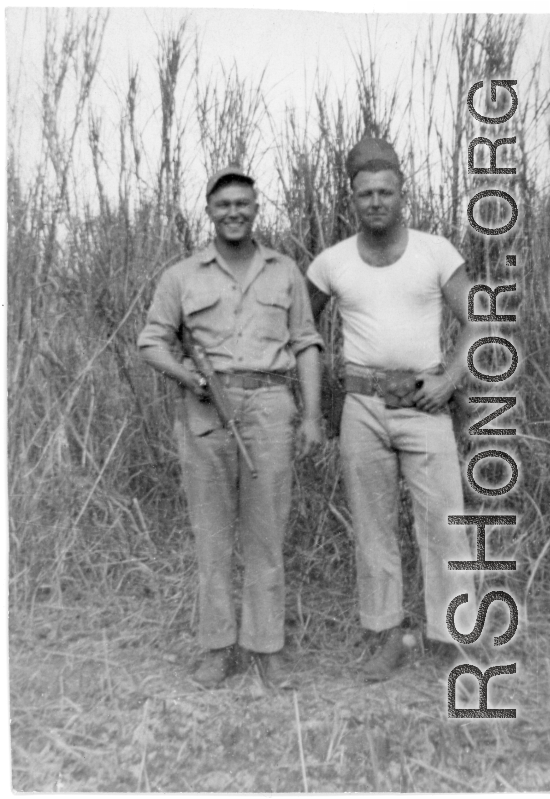 Men of 330th Troop Carrier, 9th CC, stand in a field with a carbine in the CBI during WWII.  On the left appears to be the person labeled “POP” in the bottom left of the Engine Change Crew photo, standing on the right of Arnold. POP appears in a few other photos too—he may have been an important member of the team.  From the collection of Arnold Wall. (Much appreciation to son D. W.)
