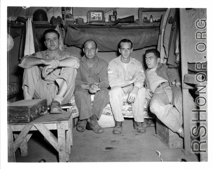 Engineers of the 797th Engineer Forestry Company pose in their barracks in Burma.  During WWII.