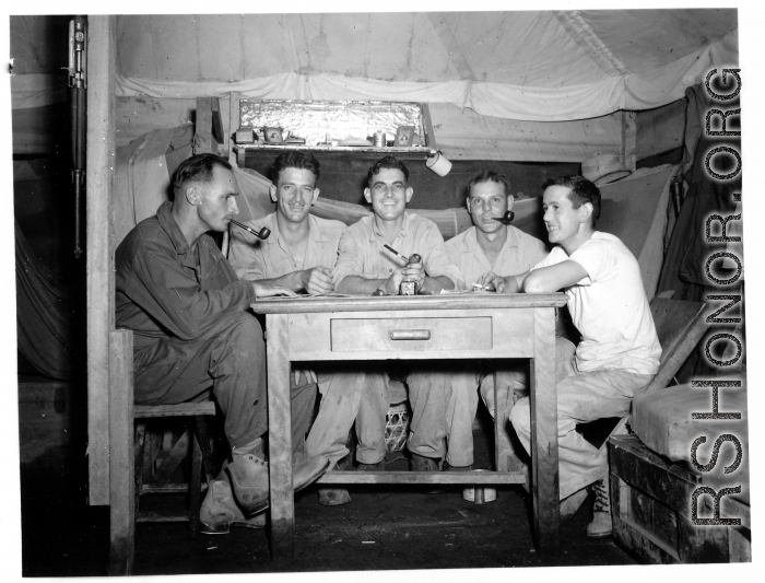 Engineers of the 797th Engineer Forestry Company pose in their barracks/tent in Burma.  During WWII.