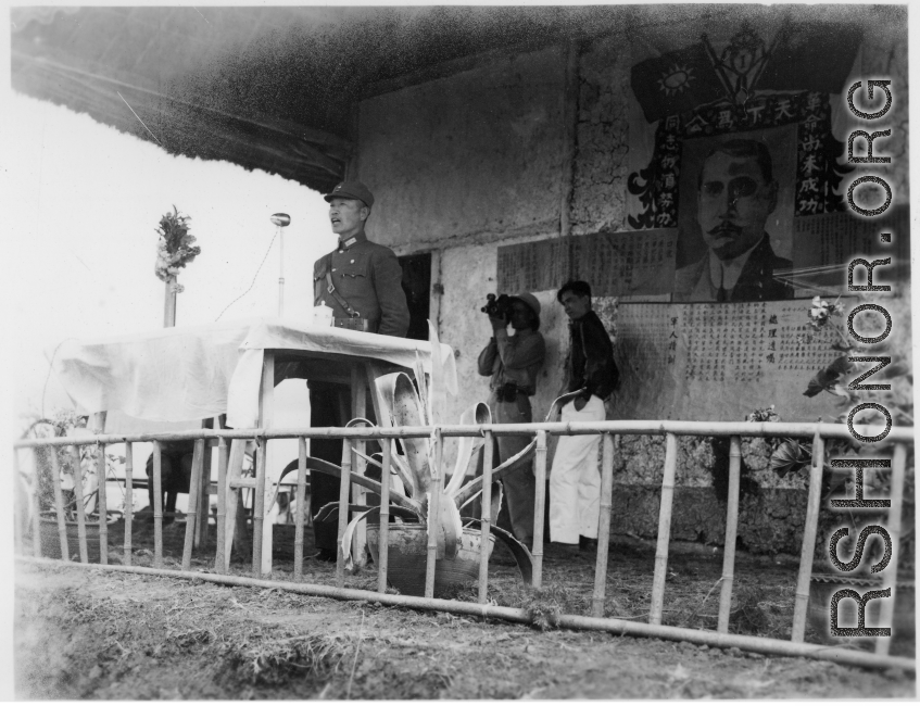 Chinese Lt. General Du Yuming, Nationalist 5th Corps (第五集团军总司令兼昆明防守司令杜聿明), makes speech during rally, while an American cameraman shoots movie film at the back.