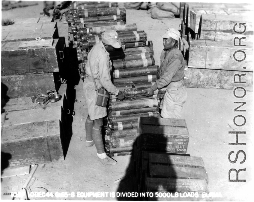 Chinese soldiers arrange equipment and munitions into 5000 lbs loads for air drop to Allied forces in Burma. 1944.