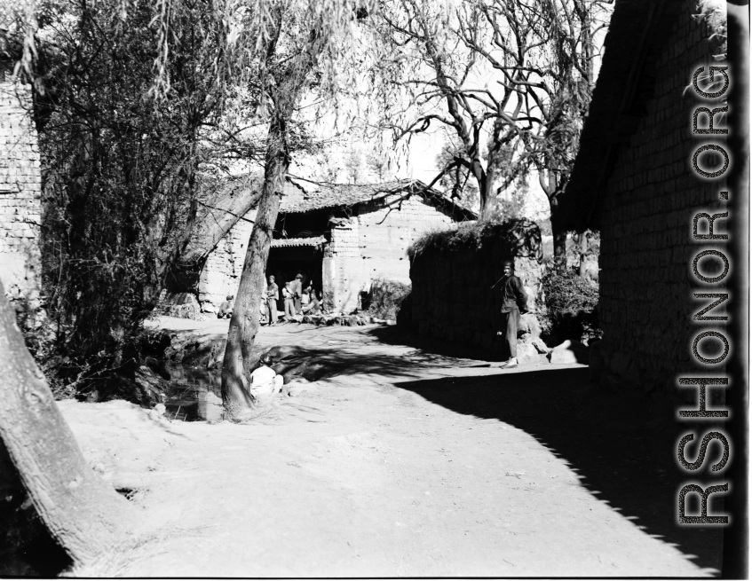 Local people in China whiling the time in a village corner.  From the collection of Eugene T. Wozniak.