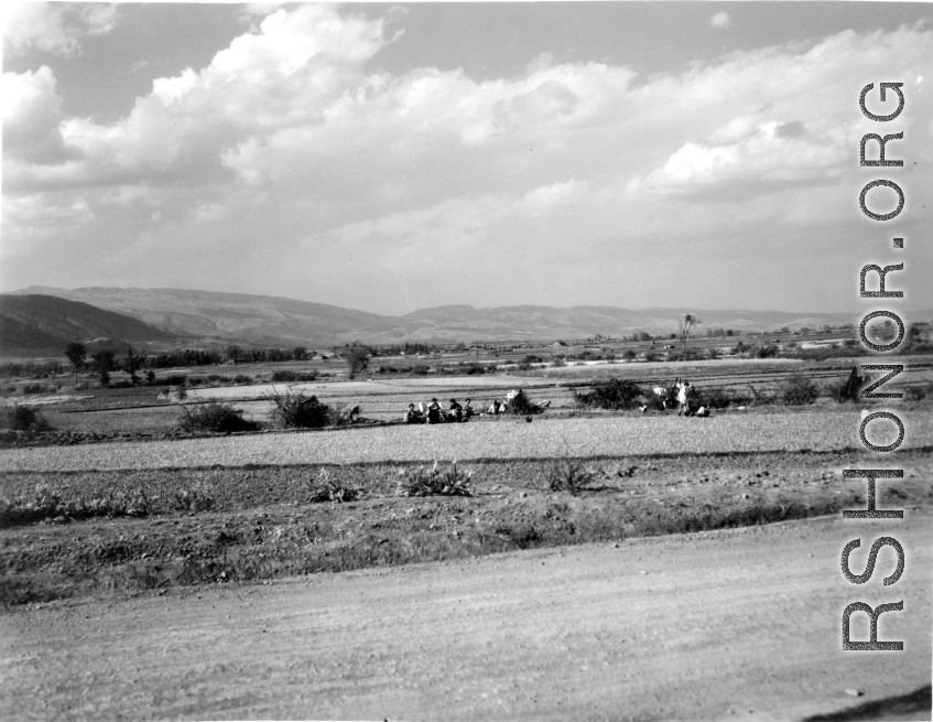 Local women drying laundry on bushes near Yangkai, Yunnan province, China, during WWII.