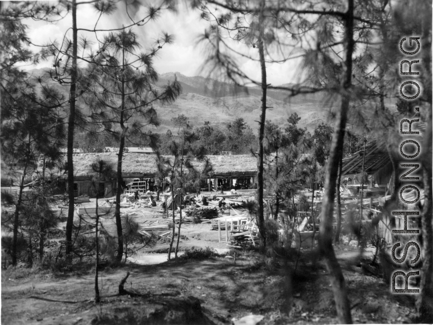 A lumber mill with carpenters furiously building items for use at the American base, at Yangkai, in Yunnan province, China.  From the collection of Eugene T. Wozniak.