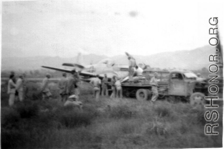 12th Air Service Group mechanics salvage a P-51 fighter in China during WWII.