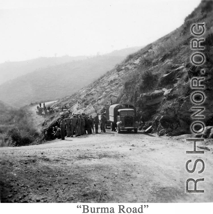 Rest break on the Burma Road, possibly to gawk at a crash or some curiosity. During WWII.