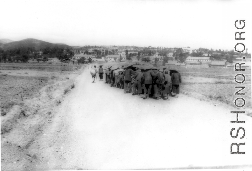 Chinese laborers move a heavy object, possibly a cement roller. During WWII. In SW China.