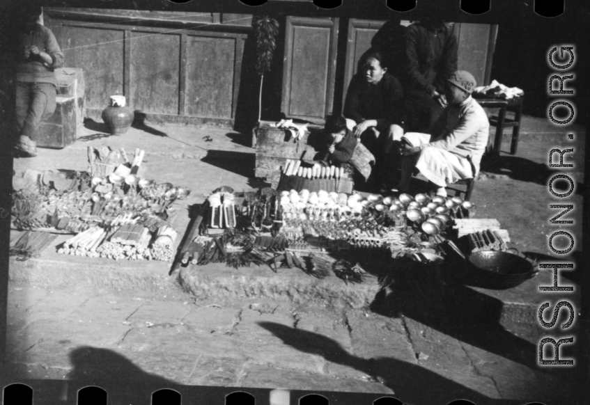 Wares laid out by a roadside hardware vendor in China during WWII.
