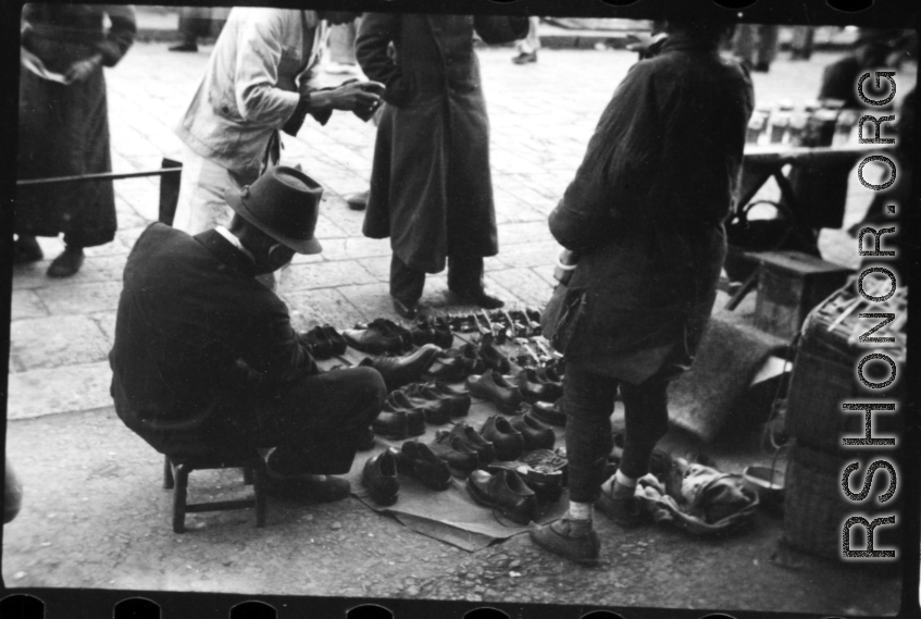 A street-side shoe vendor in China during WWII.  From the collection of Hal Geer.