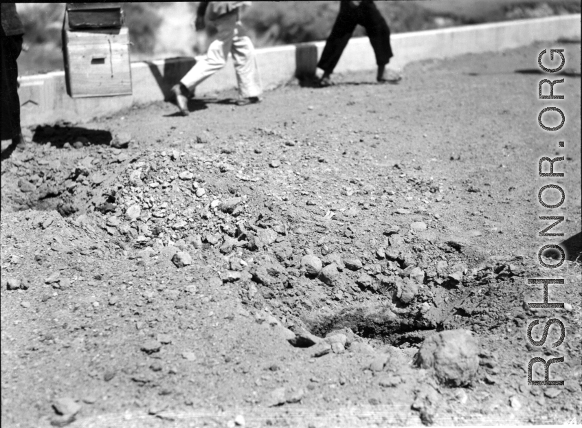 Result of explosives set on bridge by Americans in 1944 during retreat from Japanese in Guangxi province, China, during WWII.