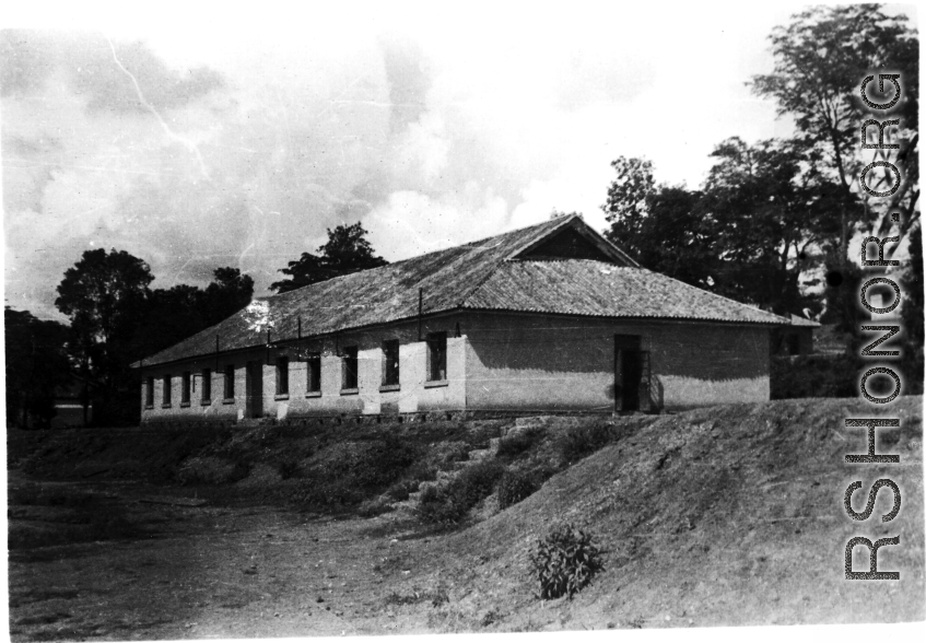 A building in the CBI, presumably used by the 27th Troop Carrier Squadron. During WWII.