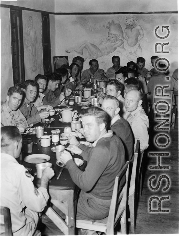 GIs eating nice meal in club house or nice mess hall in Yunnan, China, during WWII.