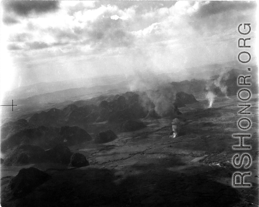 Smoke rises from probable American air attacks on Japanese ground troops, probably in Guangxi province, probably during the Japanese Ichigo campaign of 1944. 