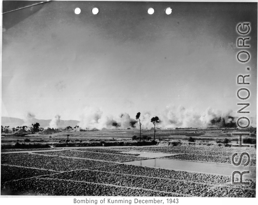 Japanese bombing of Kunming, December, 1943. The dirt pyramids are bomb bunkers.