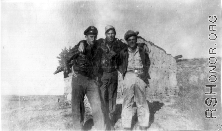 Three American flyers pose together in China during WWII. Stan Mamlock on far left.