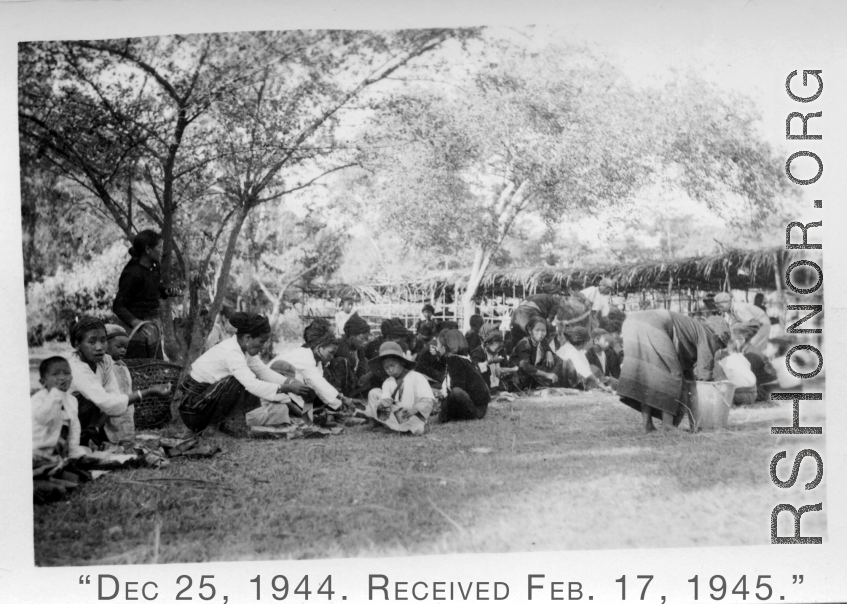 Local people in Burma near the 797th Engineer Forestry Company--A Kachin Christmas celebration on December 25, 1944, in Burma.  During WWII.