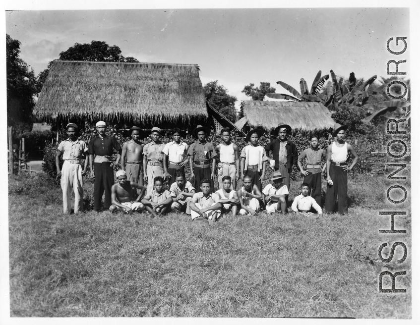 Local people in Burma near the 797th Engineer Forestry Company--A group of men pose in Burma.  During WWII.
