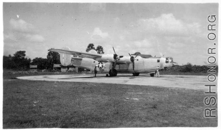 A B-24 bomber on pavement at an airbase in in Burma during WWII.