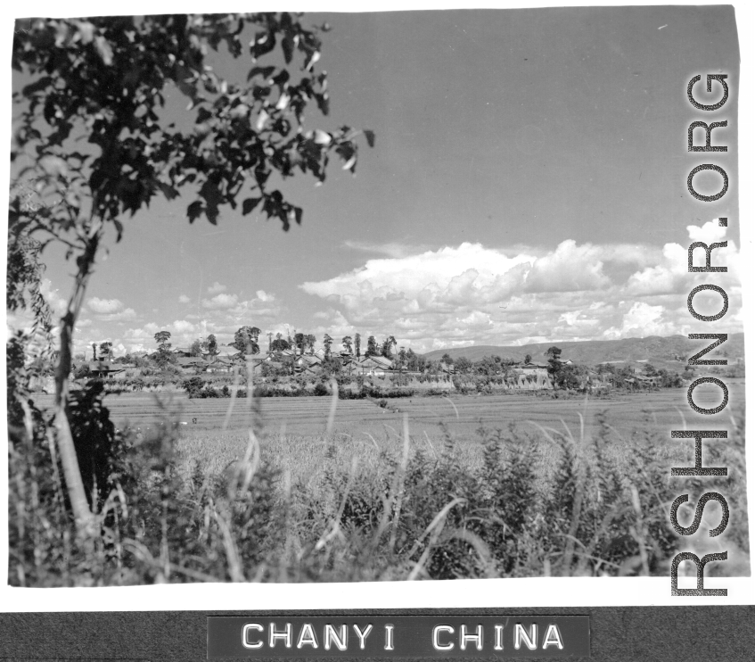 Rice paddies and walled town of Chanyi (Zhanyi), Yunnan, China, during WWII. 
