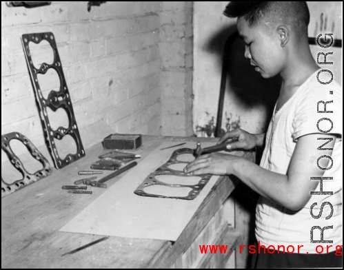 A Chinese work rehabilitates engine gaskets by hand in China during WWII.