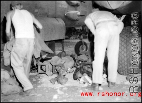 American GIs arming a B-25 for a bombing run in the CBI during WWII.