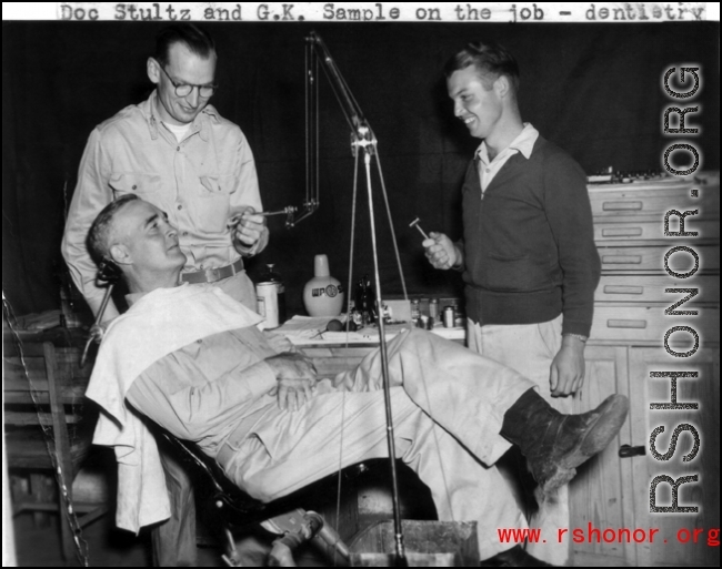Medical care somewhere in the CBI. Doc Stultz and G. K. Sample on the job--dentistry.