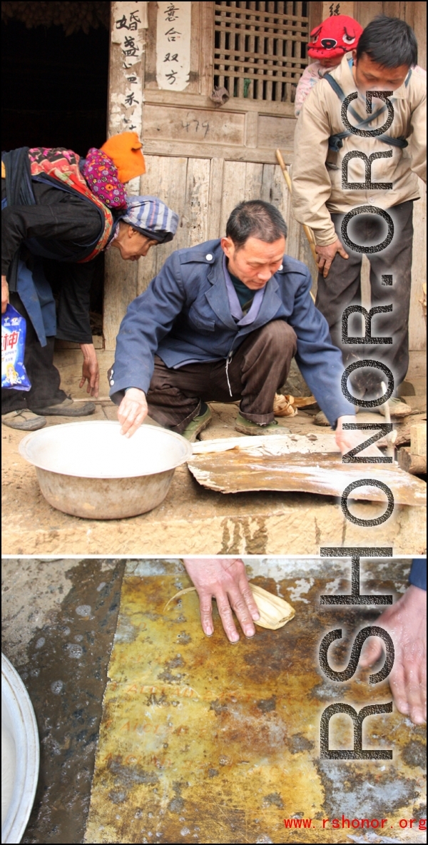 Images from January 14, 2008 visit to a WWII US crash site at Bamo township, in Tian\'e county, Guangxi province.     The extremely supportive villagers helping clean up a piece of aluminum airplane cladding, which ultimately revealed the part specification "ALCLAD 24S-T."