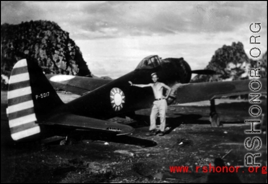 GI poses with an airplane with nationalist markings at Liuzhou base, Guangxi province.