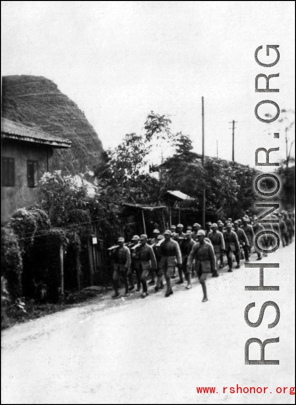 Chinese troops marching, probably at Liuzhou, Guangxi. During WWII.