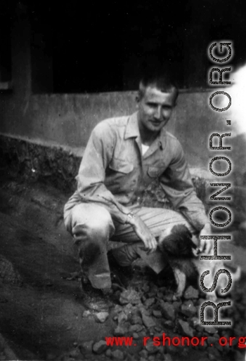 Robert Fox and puppy in the CBI, most likely at Yangkai.