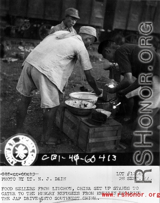 September 28, 1944  During WWII, food sellers from Liuchow, China, set up stands to cater to the hungry refugees from Kweilin (Guilin) escaping the Japanese drive into southwest China.  Photo by Lt. N. J. Dain