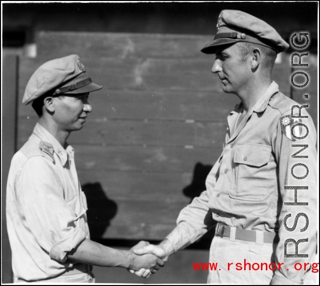 A handshake between unknown Chinese and American military personnel. In the CBI during WWII.