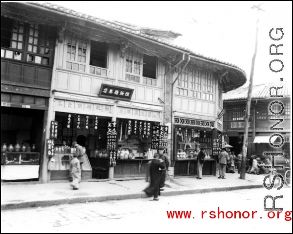 A tidy sweets shop on a street in southern China, probably Yunnan province, during WWII.