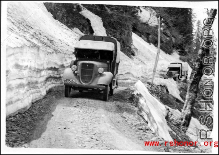 Trucks travel through mountain snow in the CBI during WWII.