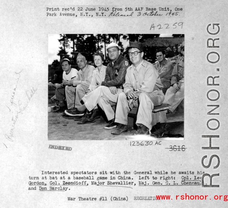 "Interested Spectators Sit With The General While He Awaits His Turn At Bat At A Baseball Game In China. Left To Right: Cpl. Lee Gordon, Colonel Zeondioff, Major Shevallier, Major General C.L. Chennault, And Don Barclay."