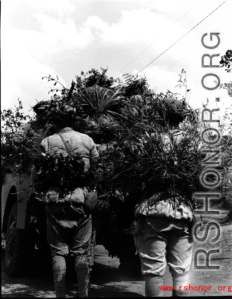 Chinese soldiers with equChinese soldiers with equipment ready and covered in camouflage standing behind American M3 Scout Car during exercises in southern China, in Yunnan province. ipment ready and covered in camouflage during exercises in southern China, in Yunnan province. Despite the appearance of being on their way to battle, these men are more likely in fact prepared for a demonstration or honor parade.