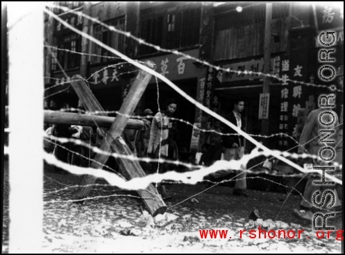 Newly installed barbed wire and barricades in Liuzhou before the Japanese Ichigo advance in the fall of 1944  From the collection of Hal Geer.