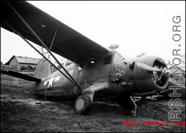 A C-64, tail number #35302, tipped into a ditch after a tornado on the flight line at Shamshernagar, Assam (India).  From the collection of David Firman, 61st Air Service Group.