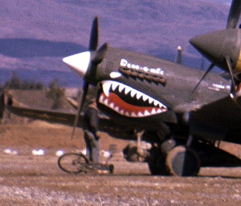 And note 'Dene-a-mite'  at the far end, with an American standing nearby with his bicycle.