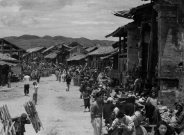 A village in SW China, on market day. In the CBI during WWII. 