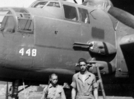 Chinese soldier and American engineer stand before the new 25, #448, Yangkai, May 1944.  Unknown, Frank Bates.