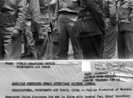 Pauline Frederick of Western Newspaper Union discusses the war in China with General Pao, while Captain William T. Randolph looks on.