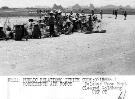 Chinese laborers rest at noon on their work to rebuild the air strip at Liuzhou, Guangxi province, in the CBI, in 1944.