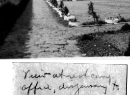 Barracks area to Camp Schiel, China during WWII, February 1945, and railway beyond.