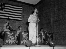 The "Jive-o-Lieps" of the 54th Air Service Group play music as a young GI works the microphone. In the CBI during WWII.