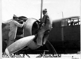 Chinese ground crew work on an engine of a B-25 as part of the Chinese-American Overseas Training Unit program at Karachi Air Base, India. September 1943.