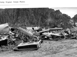 Engineers scavenge parts at Guilin (Kweilin) Air Field in a boneyard of parts of American military aircraft during WWII.  Army Signal Corps photo.