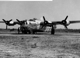 A B-24 bomber without the paint finish, in shiny aluminum, in the CBI during WWII.